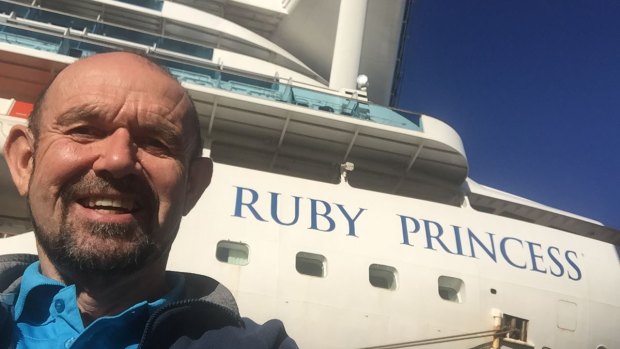 Dr John Parker with the docked Ruby Princess cruise ship.