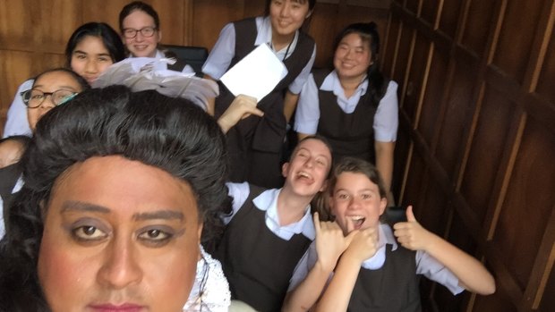 Sydney Girls High School students take a selfie with Asalemo Tofete, who plays Titania at Pop-up Globe Sydney. 