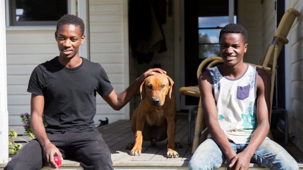 Ezekia Nitanga, 19, left, with his brother. Their family relocated to the New England region after failing to settle in Sydney. 