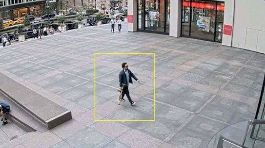 The man believed to be the gunman walking into the building in New York City.