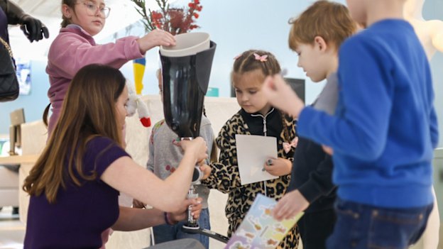Children examine a prosthetic limb at the Superhumans Centre in western Ukraine.
