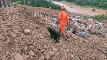 Personnel from India’s National Disaster Response Force and others trying to rescue those buried under the debris in Noney, northeastern Manipur state, India.