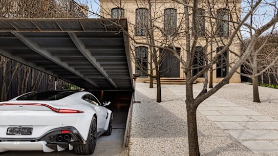The home has an Aladdin’s cave garage that has a cantilevered door.