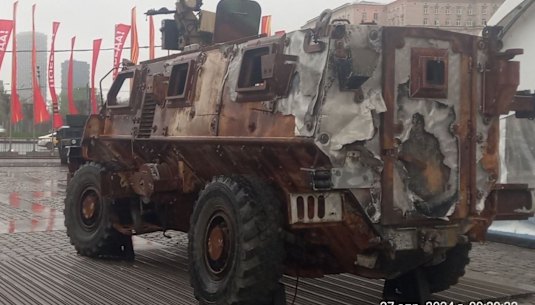 A blast-damaged Bushmaster vehicles in Moscow in a display from the Kremlin of its trophies seized on the Ukrainian battlefields.