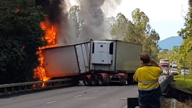 Two people died, but a baby is recovering well after a fiery car and truck crash in north Queensland on Tuesday.