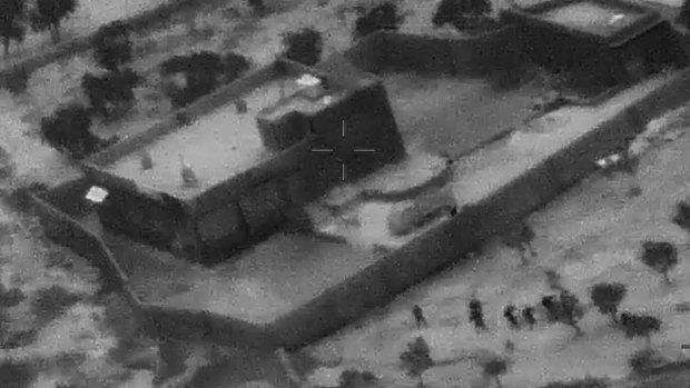 US Special Forces, figures at lower right, moving toward compound of Islamic State leader Abu Bakr al-Baghdadi.