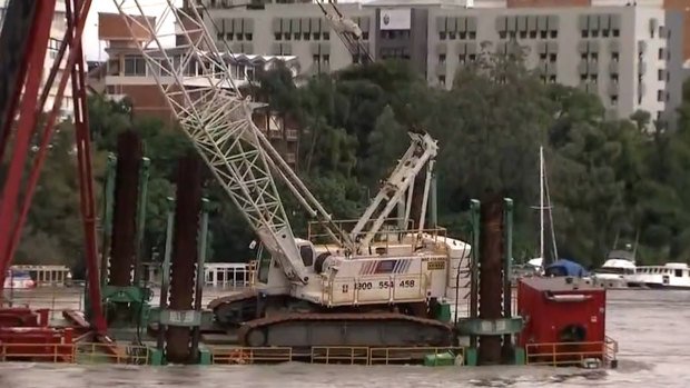The Story Bridge in Brisbane has been closed and Howard Smith Wharves have been evacuated, after a pontoon carrying a crane broke free.
