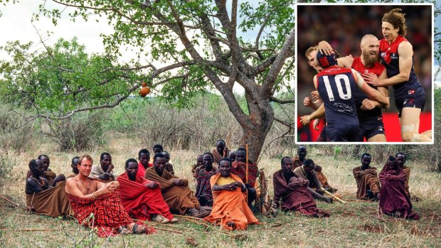 Charles Lane with the nomadic Barabaig people of Tanzania. Inset: Max Gawn celebrates a goal in the prelim final.