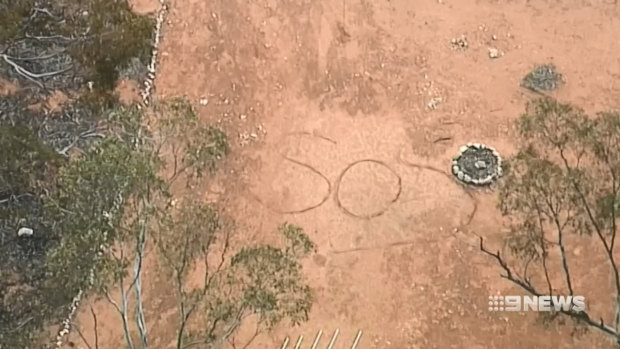 This SOS message scrawled in dirt and captured on CCTV led police to Deborah Pilgrim.