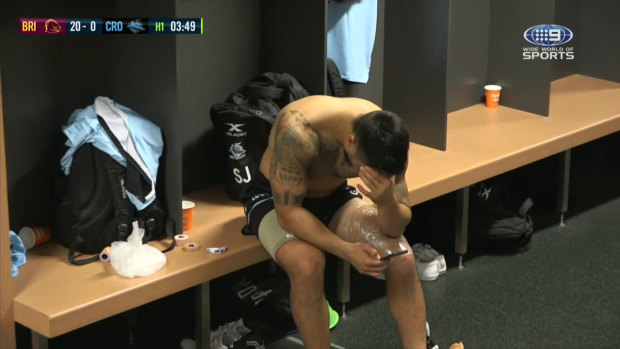 Body blow: Shaun Johnson in the dressing-room in Brisbane on Saturday night after injuring his hamstring.