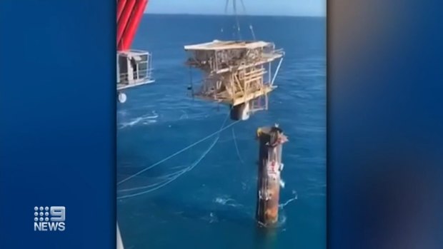 An oil platform swings uncontrollably near workers off the coast of Western Australia.