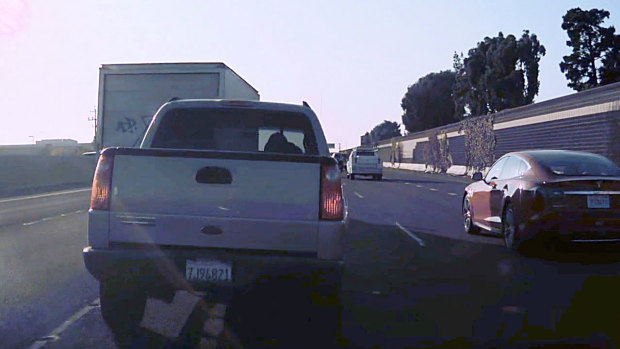 A still image from dashcam video provided by Benjamin Swanson shows a truck driven by Benjamin Maldonado on a California freeway seconds before it was struck by a Tesla Model 3 that was traveling about 60 miles per hour on Autopilot. Swanson is an attorney for the family of 15-year-old Jovani Maldonado, who was killed in the crash. 