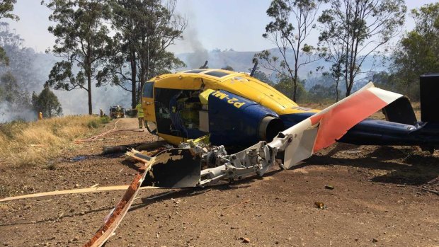 The crashed water bombing helicopter near Toowoomba on Wednesday.
