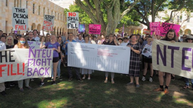 Staff and students rally at the University of Queensland on Friday against proposed changes being imposed on the School of Architecture.
