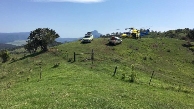 Man escaped serious injury after throwing himself out of his tractor that fell down a hill in the Scenic Rim.