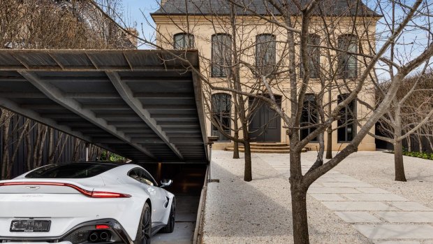 The home has an Aladdin’s cave garage that has a cantilevered door.