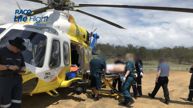 The patient is loaded onto the rescue helicopter before being taken to Princess Alexandra Hospital in Brisbane. 
