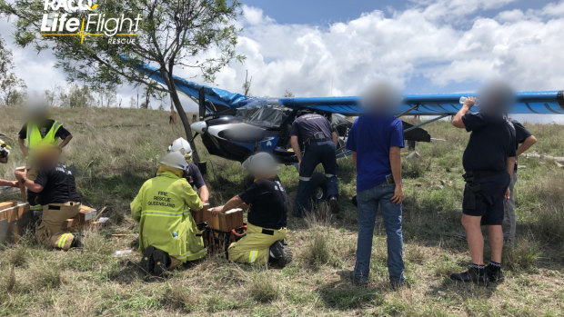 Emergency service workers at the scene of the crash near Aratula. 