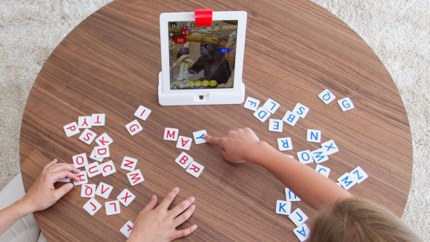 These games, including Tangram, combine physical pieces with a digital screen.