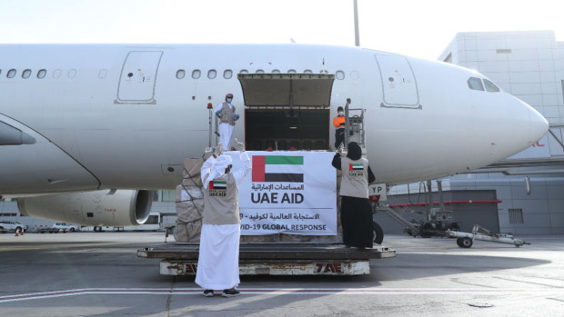 An Etihad Airways flights loaded with aid for the Palestinians to fight the coronavirus pandemic is loaded in Abu Dhabi, United Arab Emirates.
