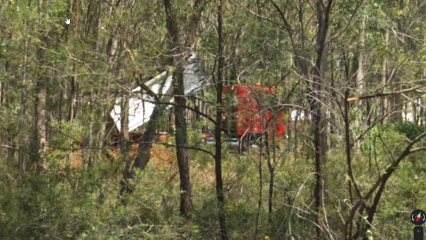 A photograph appears to capture the red truck in the act of dumping. 