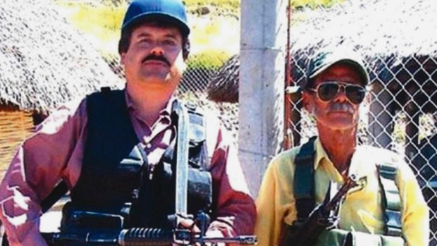 Joaquin "El Chapo" Guzman, left, poses with an unidentified man. 