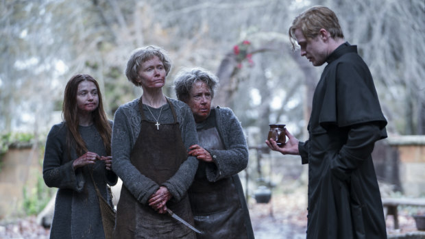 Jessica Barden as Sister Carla (left), Essie Davis (Sister Iphigenia) and Ann Dowd (Sister Margarita) confront Sam Reid (Father Ignatius) when he arrives unexpectedly at the convent.