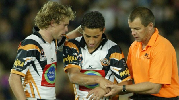 Benji Marshall is taken from the field with a shoulder injury in 2004.