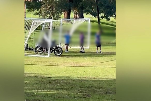 Vision of the trio driving over a community sporting ground. 