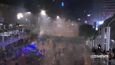 Hundreds of protesters have been taken into custody with wads of cash that police claim were rewards for rioting in Jakarta