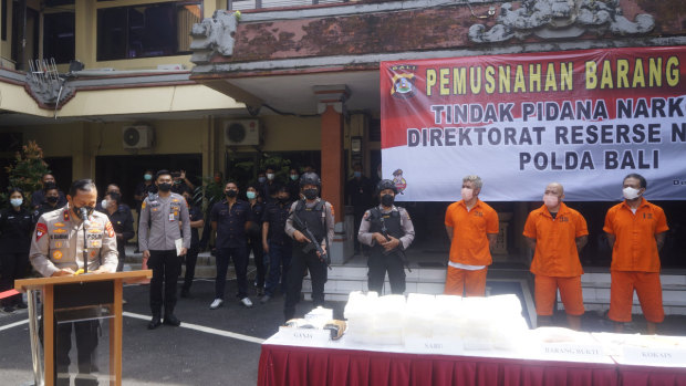 Bali police hold a press conference in June parading the three Indonesian men arrested at a Kuta villa in April.