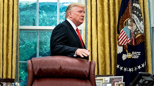 Stymied: President Donald Trump prepares to leave the Oval Office after a presentation at the White House lat last week.