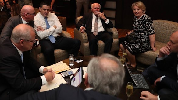 Waiting for Shorten to concede from left: Scott Morrison, chief of staff John Kunkel, campaign director Andrew Hirst, John and Janette Howard, head of media Andrew Carswell.