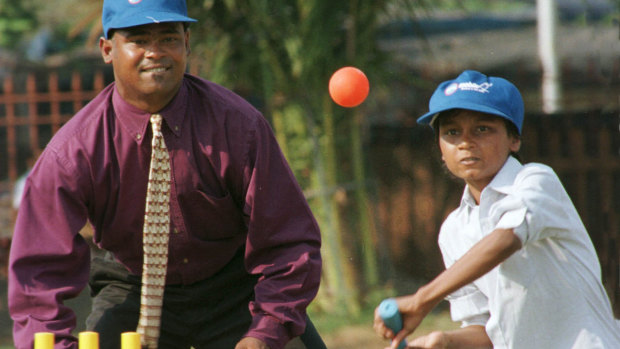 Batsman Vinod Kambli with a young protege. 