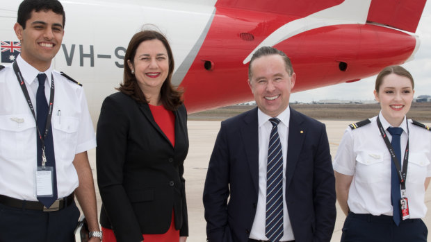Qantas CEO Alan Joyce and Queensland Premier Annastacia Palaszczuk with two student pilots,  Baha'a Fayoumi and Inez Leggett at Toowoomba in Queensland on Thursday. 
