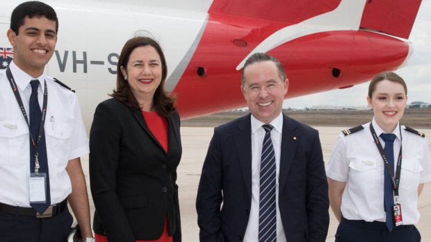 Qantas CEO Alan Joyce and Queensland Premier Annastacia Palaszczuk with two student pilots,  Baha'a Fayoumi and Inez Leggett at Toowoomba in Queensland on Thursday. 