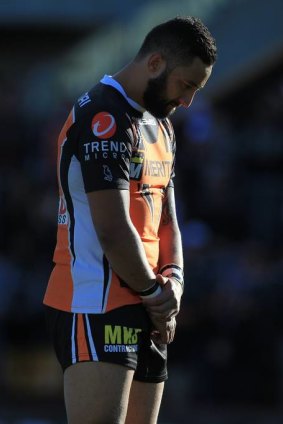 Remembrance: Tigers' Benji Marshall stands in a minutes silence for Robbie Farah's mother.
