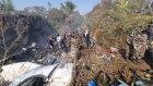 Rescue teams working at the wreckage of a Yeti Airlines ATR72 aircraft after it crashed in Pokhara, Nepal,
