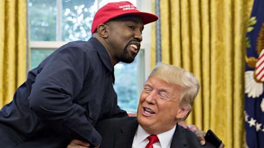 Rapper Kanye West shakes hands with US President Donald Trump during a meeting in the Oval Office of the White House in 2018. 