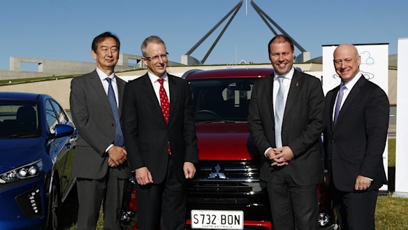 Mitsubishi chief executive Mutsuhito Oshikiri, Minister for Urban Infrastructure Paul Fletcher, then-minister for Environment and Energy Josh Frydenberg and then-AGL chief executive Andy Vesy at an electric car event in 2017.