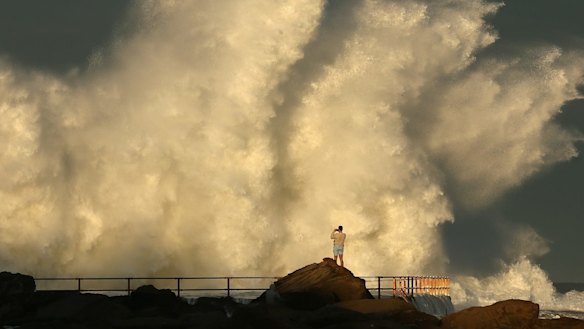 Large wave hits a rock pool at Curl Curl beach in Sydney. 
