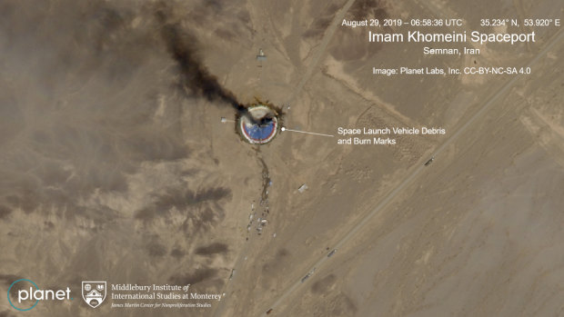 The satellite image shows the smoldering remains of a rocket at a Iran space centre.