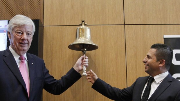 Anchorage Capital Partners managing director Phil Cave rings the bell  with Dick Smith CEO Nick Abboud at the retailer's stock market debut.