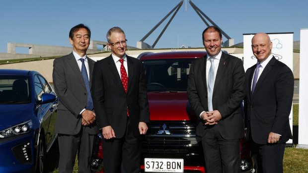 Mitsubishi chief executive Mutsuhito Oshikiri, Minister for Urban Infrastructure Paul Fletcher, then-minister for Environment and Energy Josh Frydenberg and then-AGL chief executive Andy Vesy at an electric car event in 2017.