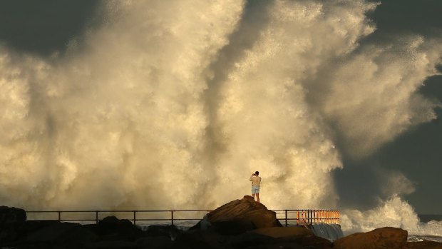 Large wave hits a rock pool at Curl Curl beach in Sydney. 