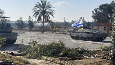 A tank with an Israel flag on it entering the Gaza side of the Rafah border crossing on Tuesday.