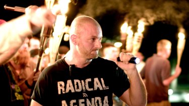 Crypto-currencies are a favourite of the alt-right. Here a white nationalist stands at a rally in Charlottesville, Virginia in 2017.