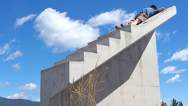 Thomas Schulze takes a nap on the Cotter’s infamous stairs to nowhere.