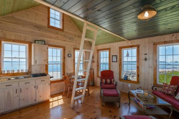 The home is a beautifully crafted wooden cabin. 
