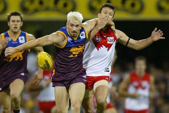 Jason Akermanis (centre) in action for the Lions in 2005 against Sydney